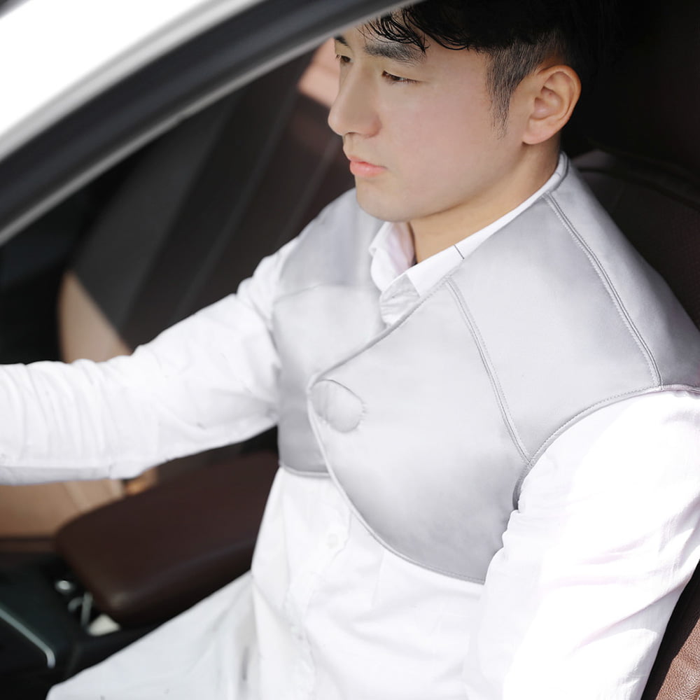 T10 Graphene Heated Silk Shoulder Neck Pad: man wearing the shoulder wrap in a car.
