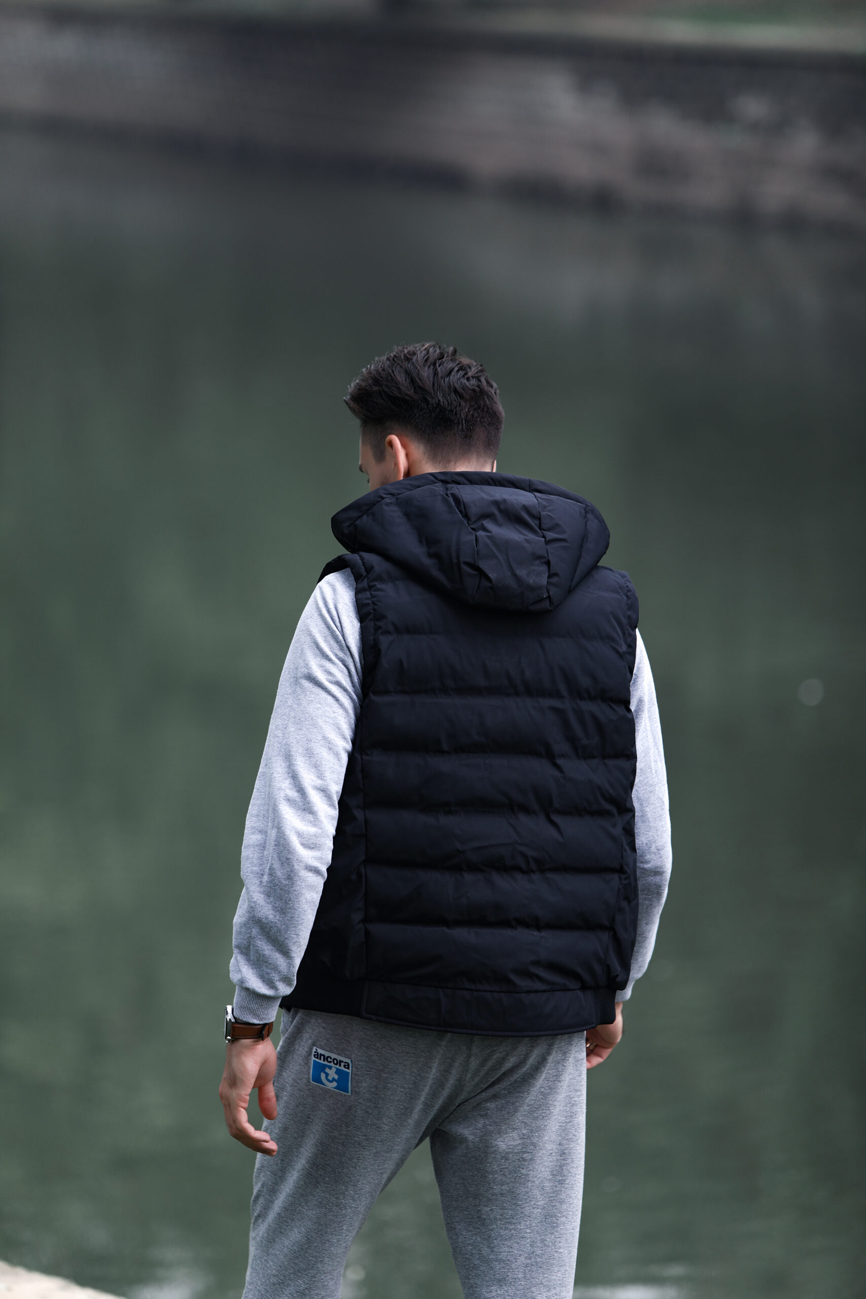 J10 Graphene Heated Casual Vest: rear wearing view beside a lake.