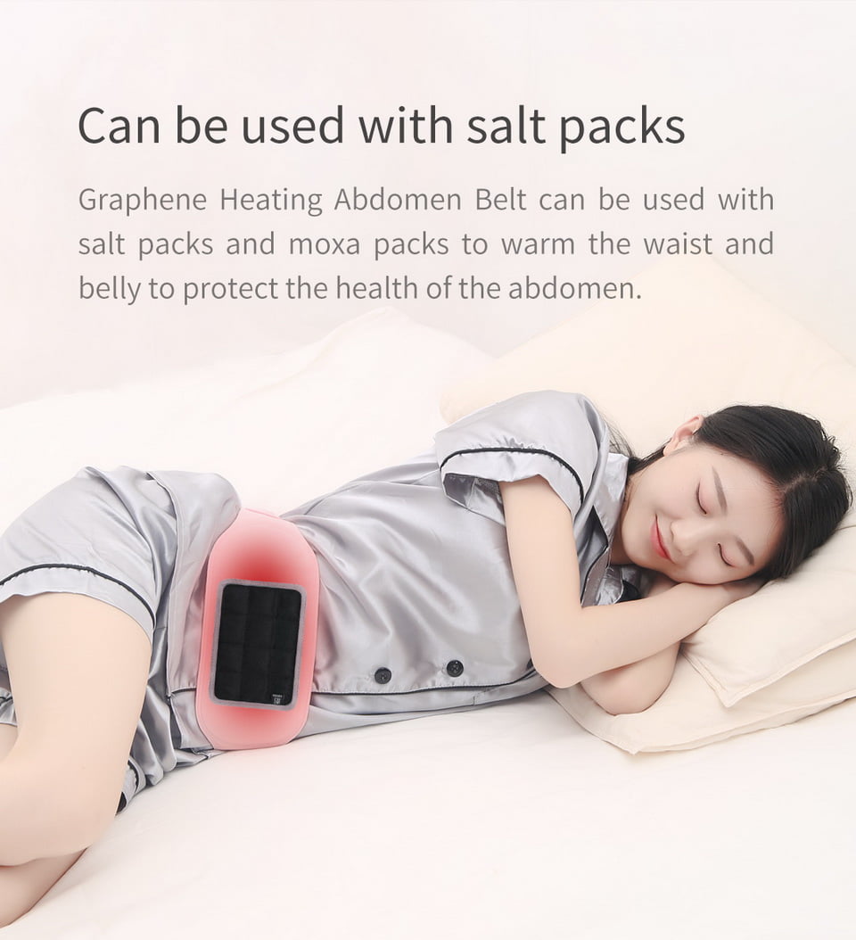 S20 Graphene Heated Abdomen Belt: woman resting on her side while wearing the pink belt.