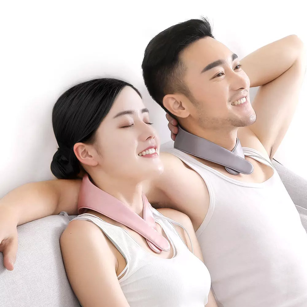 C10 Graphene Heated Silk Neck Strap: couple reclining while wearing neck straps.