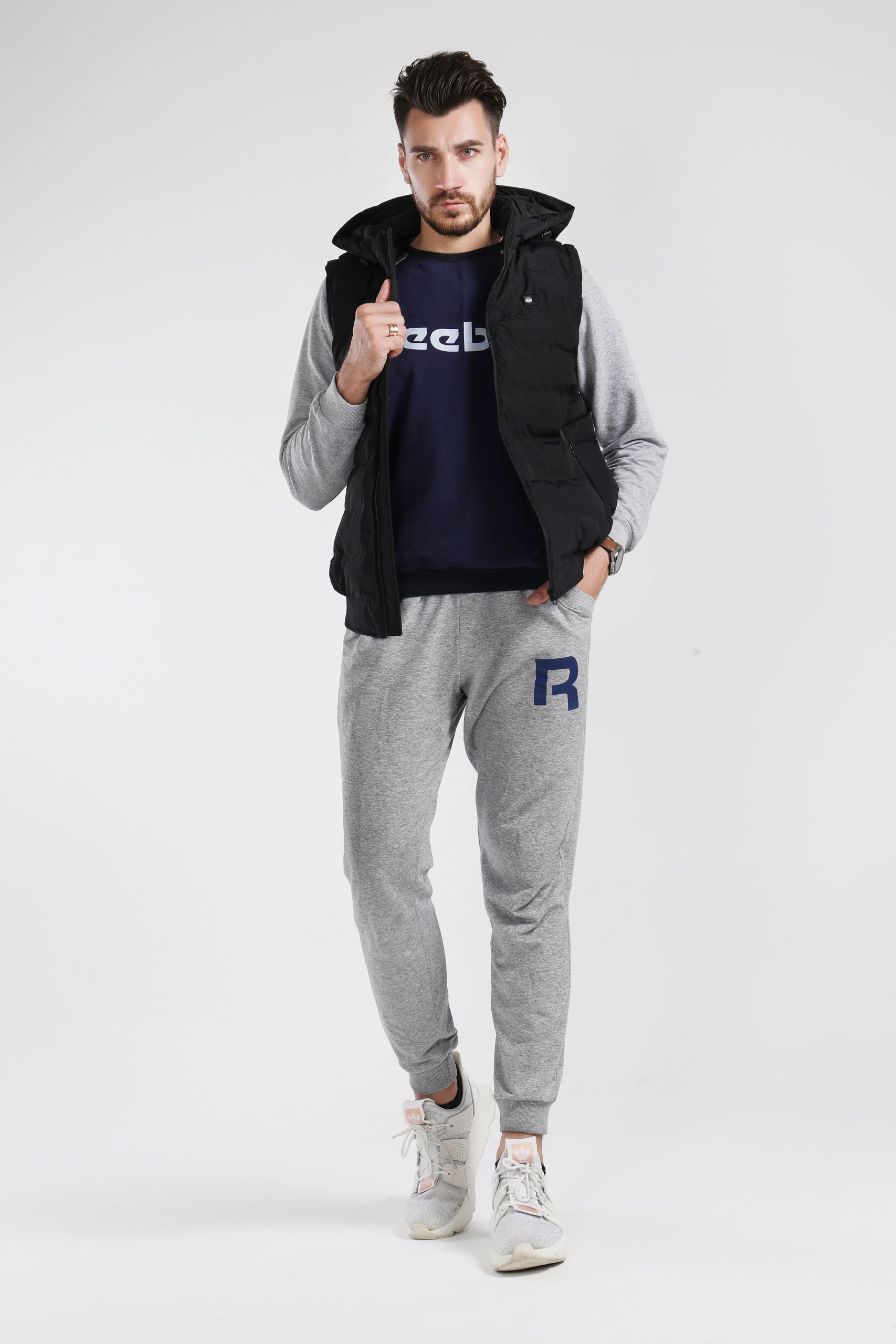 J10 Graphene Heated Casual Vest: man wearing the vest with a dark shirt.