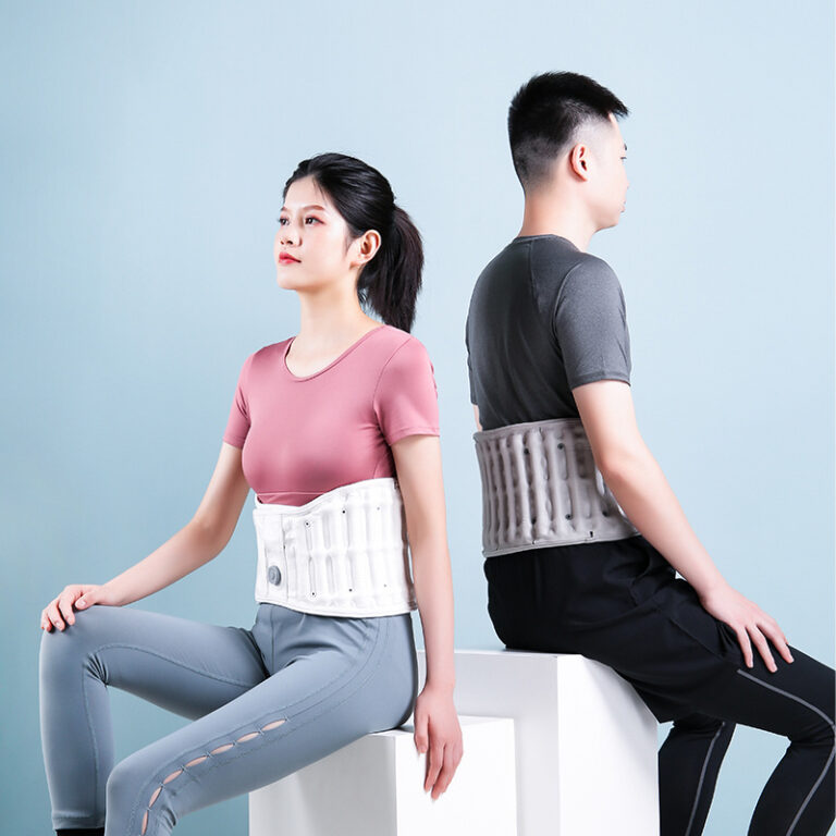 D30 Graphene Heated Airbag Lumbar Support Belt: couple seated back-to-back wearing white belts.