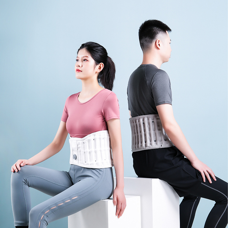 D30 Graphene Heated Airbag Lumbar Support Belt: couple seated back-to-back wearing white belts.