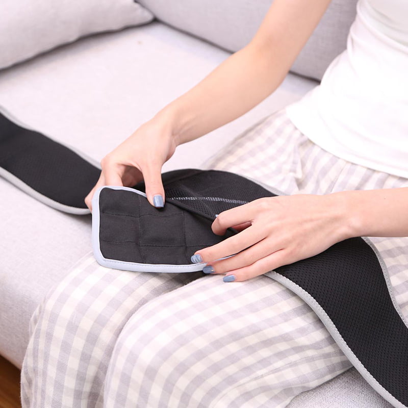 F10 Graphene Heating Salt & Herb Belt: woman placing the insert into the inner pocket.