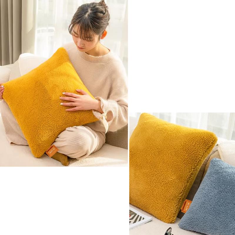 Graphene Far Infrared Heating Pillow Blanket: woman holding a yellow pillow with a fabric close-up.