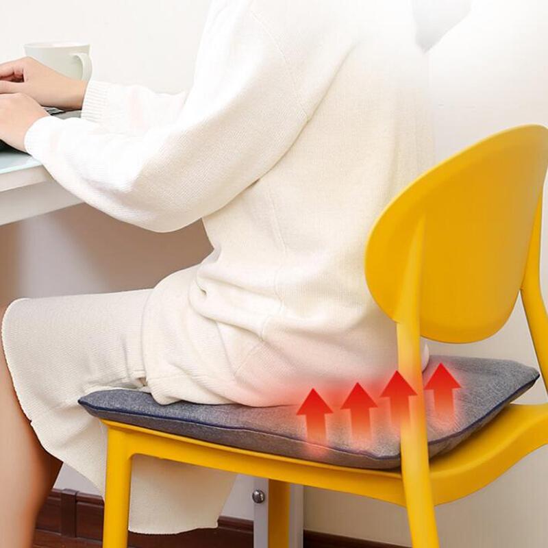 Graphene Heating Seat Cushion: seat cushion in use on a yellow chair.