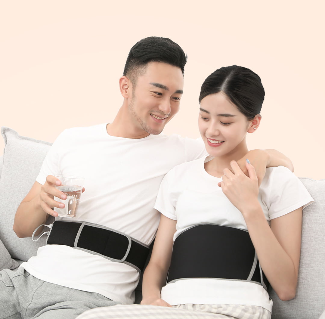F10 Graphene Heating Salt & Herb Belt: couple seated while wearing the belts.