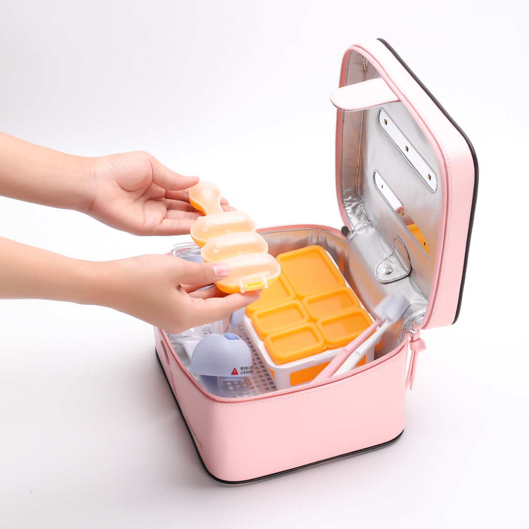 Pink UV disinfection box holding small household items