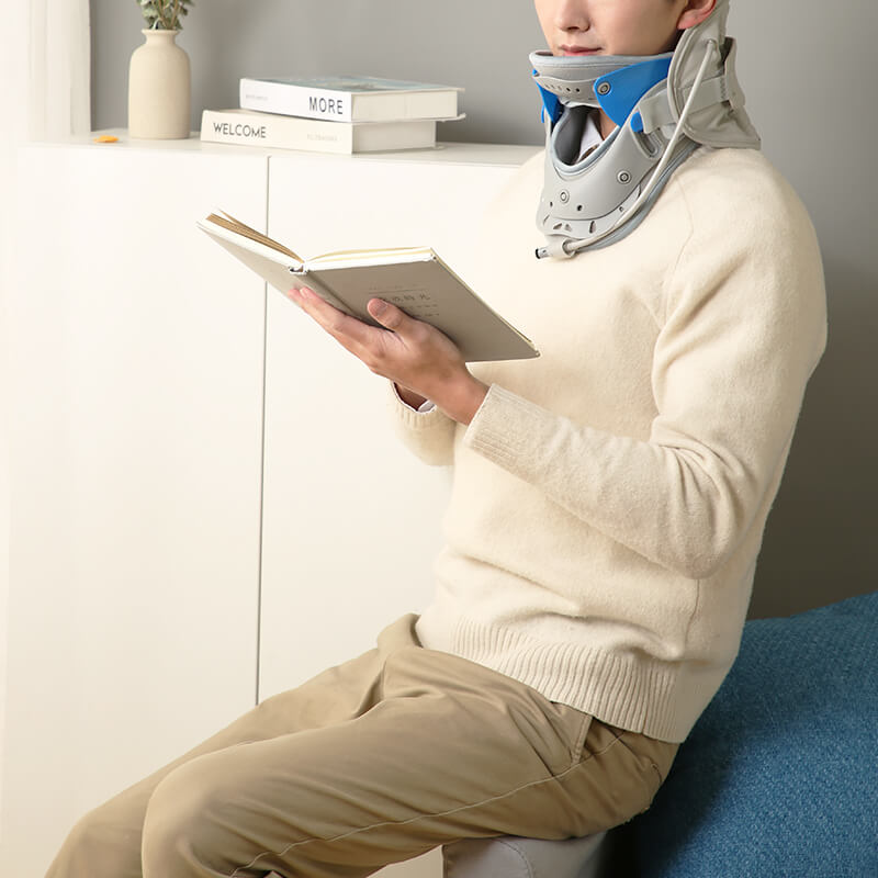 Woman reading while wearing the cervical neck brace