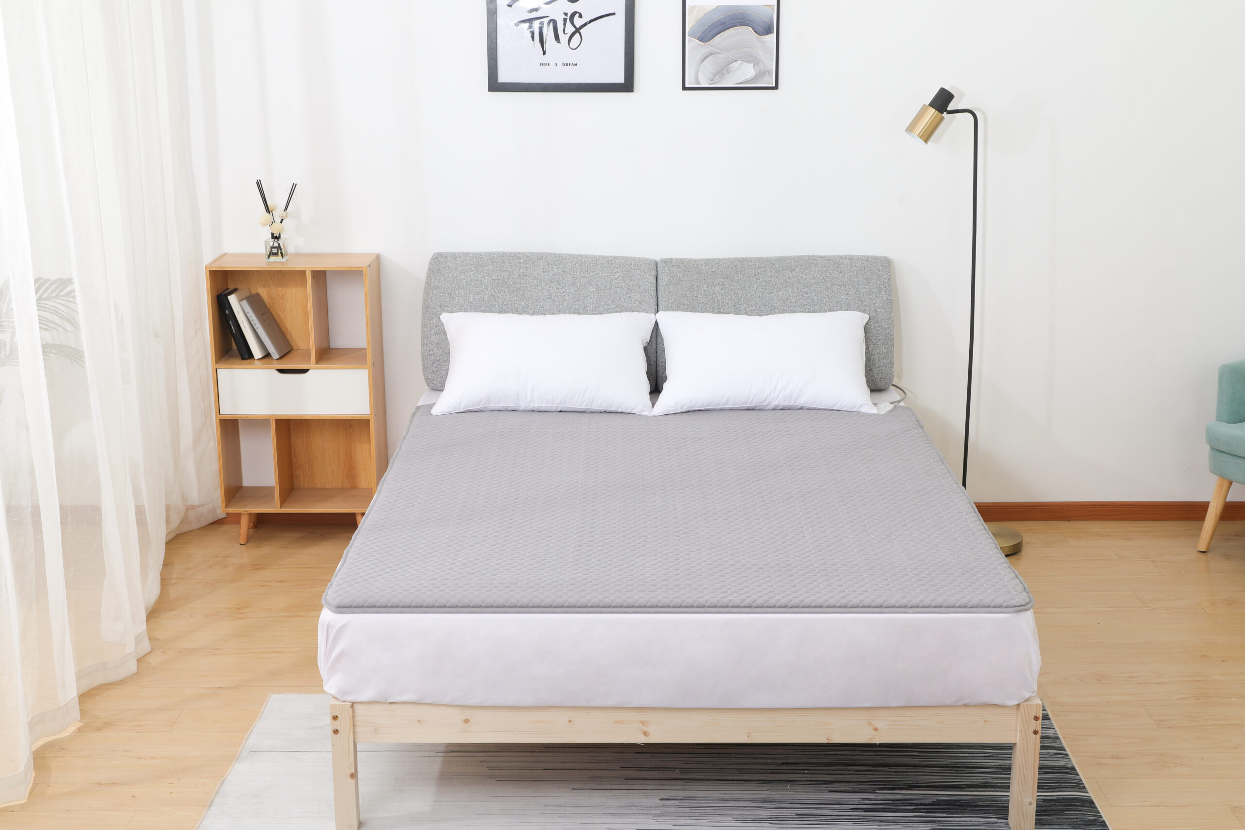 W20 Graphene Low-Voltage Smart Heated Blanket: blanket laid flat across a bed.