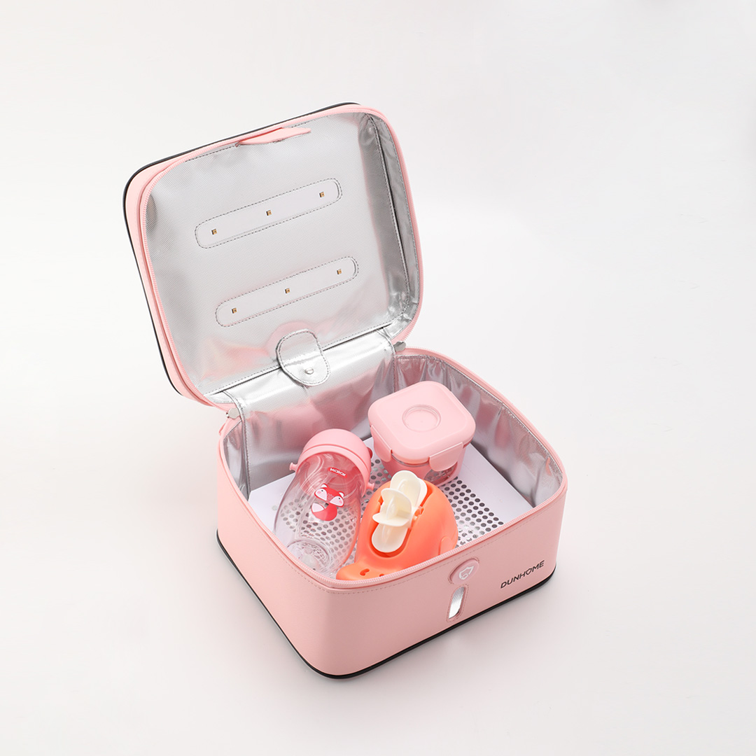 Pink UV disinfection box holding personal accessories