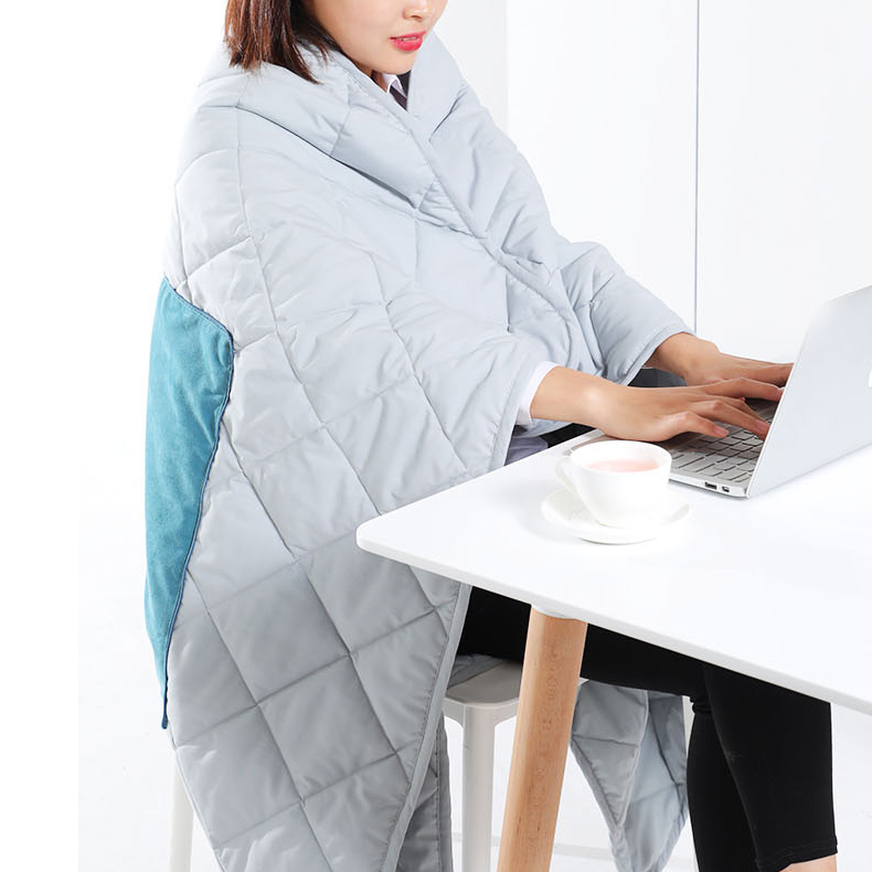 Graphene heated pillow blanket used while working