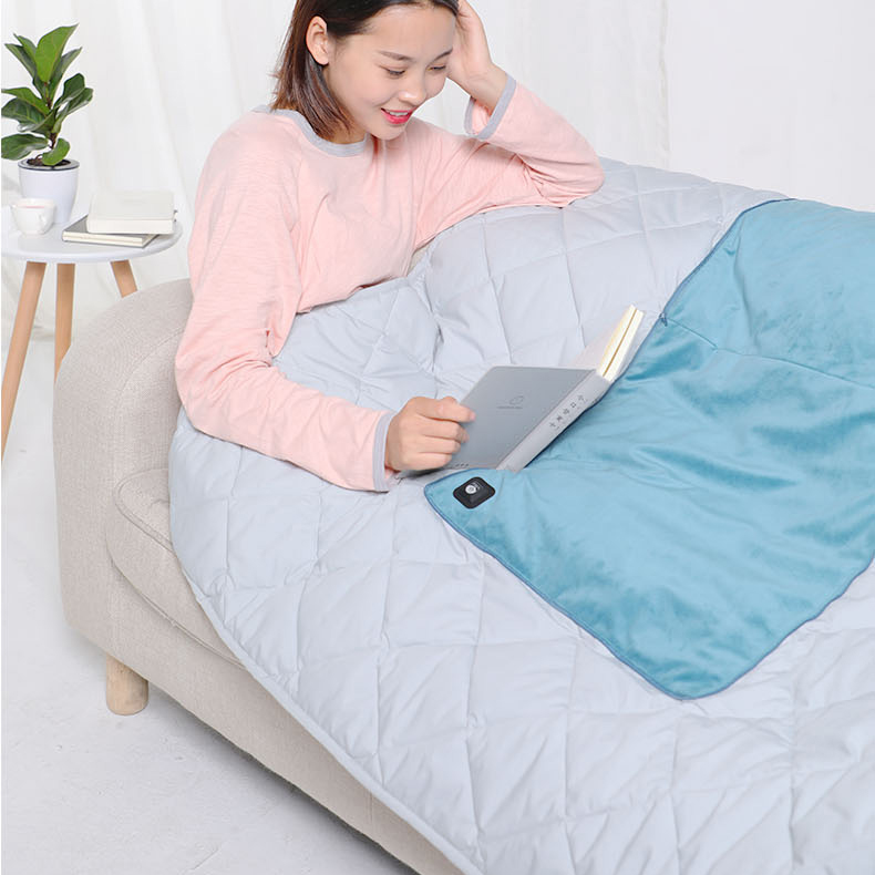Graphene heated pillow blanket used while reclining