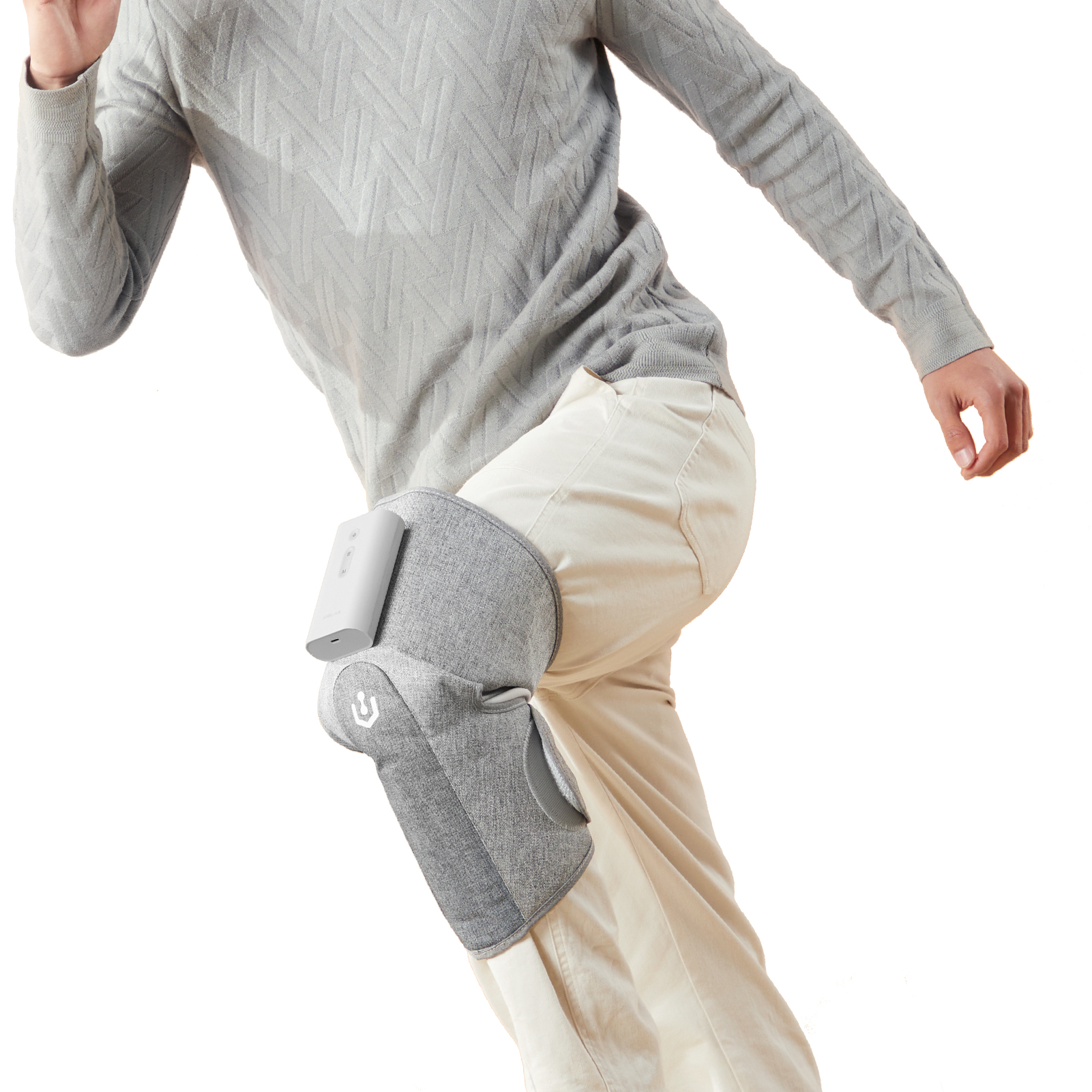 Graphene Compression Leg Sleeves: gray sleeve worn over trousers, angled view.