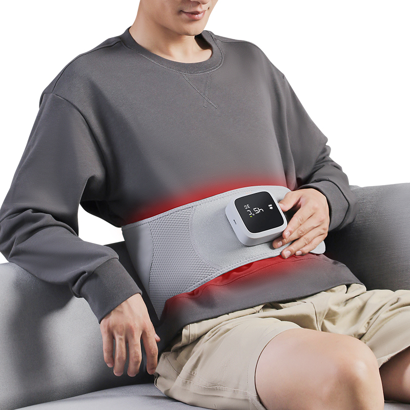 Waist Massage Belt: man wearing the belt while seated.