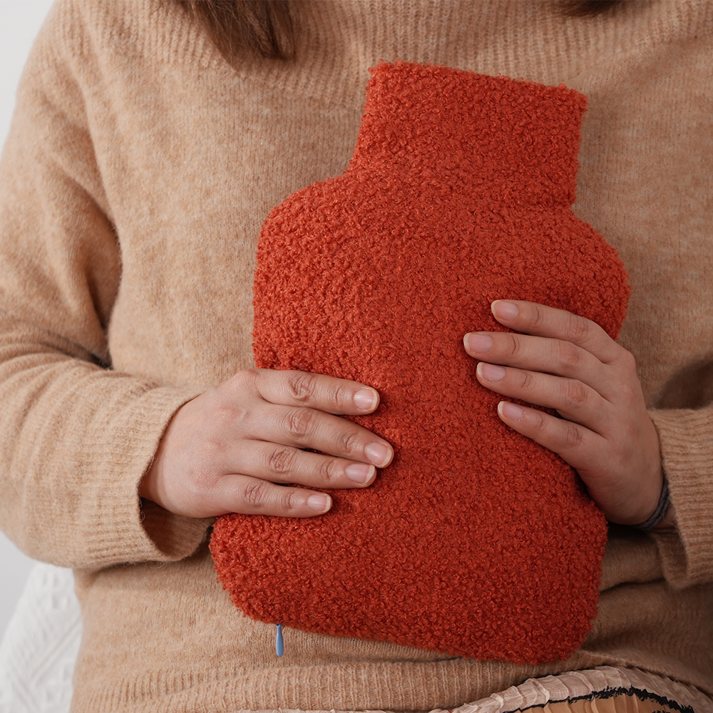 Red hand warmer used on the abdomen
