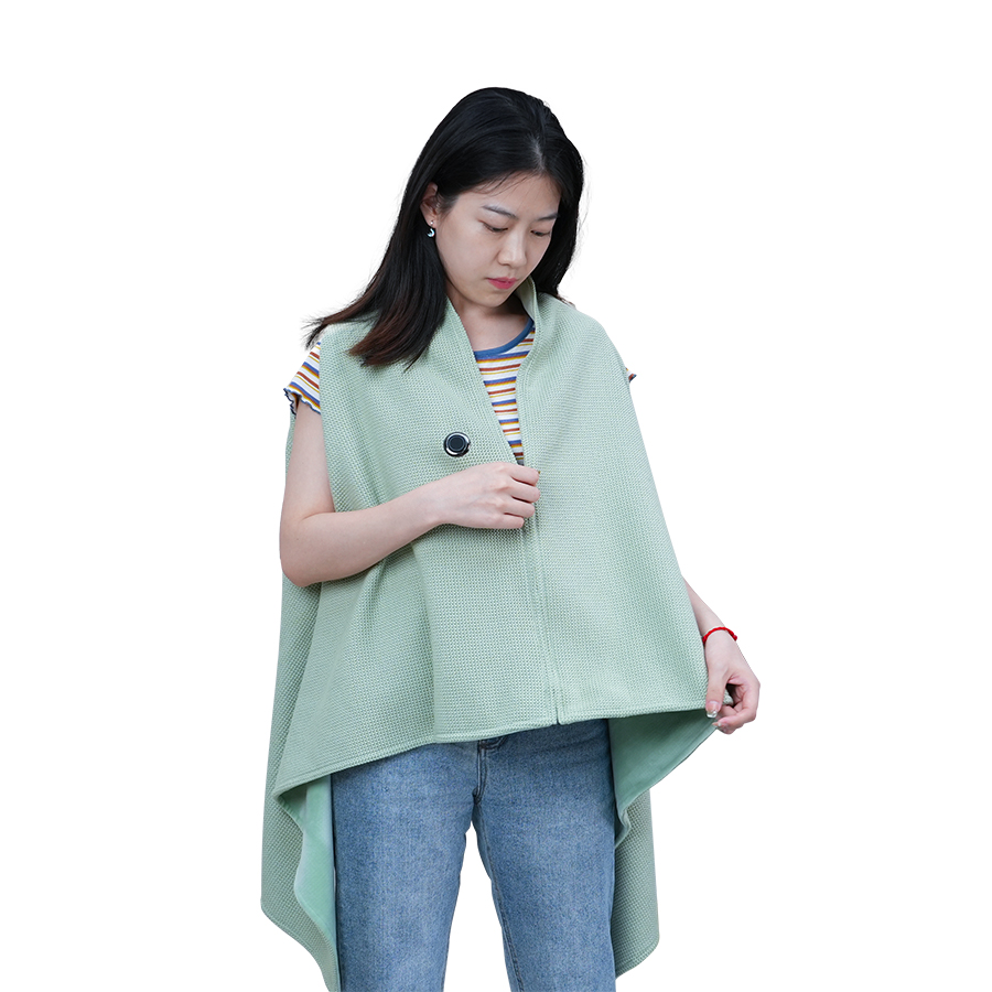 Woman showing the open front of the mint heated shawl