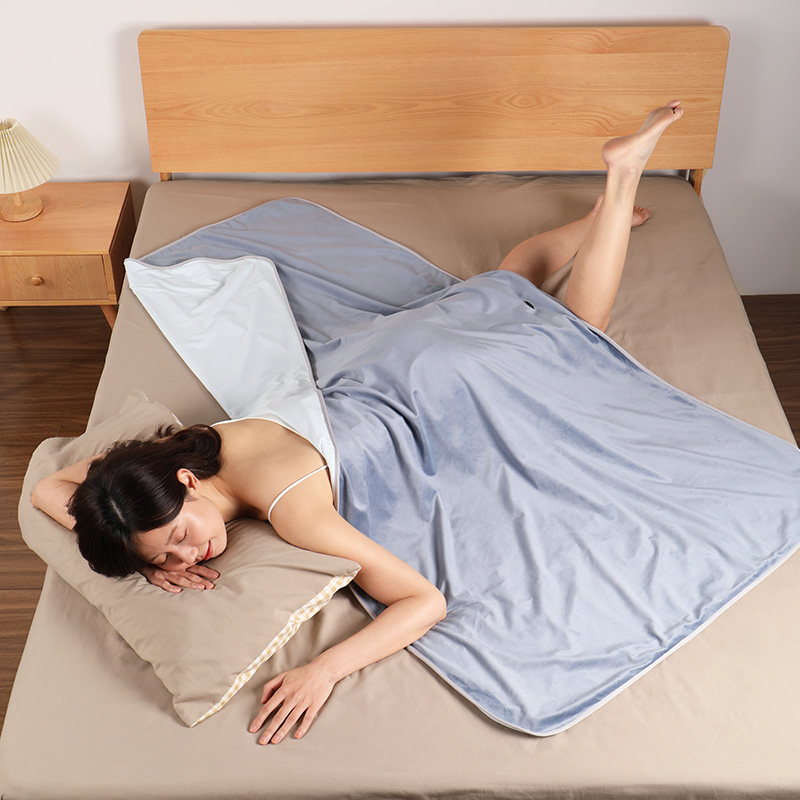 Graphene Heated Antibacterial Blanket: blanket used on a bed.