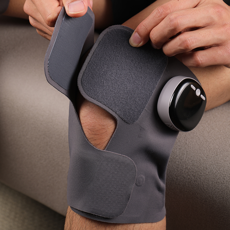 EMS Lightweight Knee Brace: close-up of the strap being fastened.