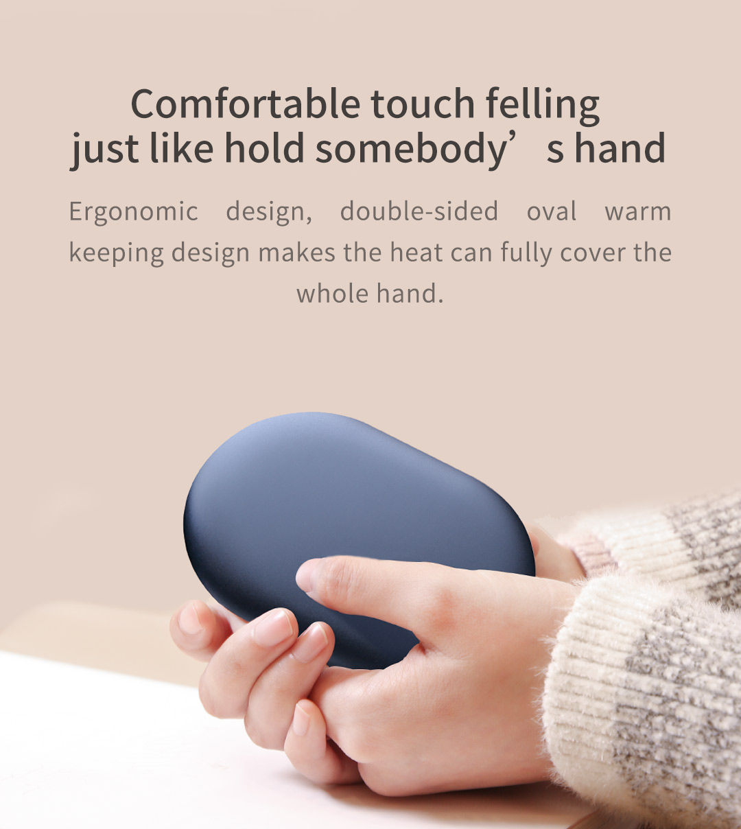 Z20 Graphene Heated Hand Warmer: blue hand warmer held between both hands.