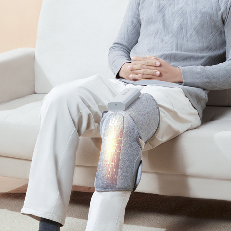 Graphene Compression Leg Sleeves: single sleeve worn while sitting on a sofa.
